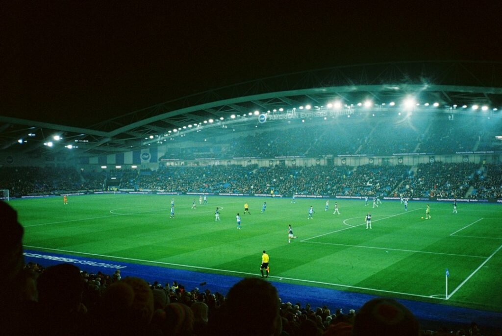 Football stadium illuminated for an evening match